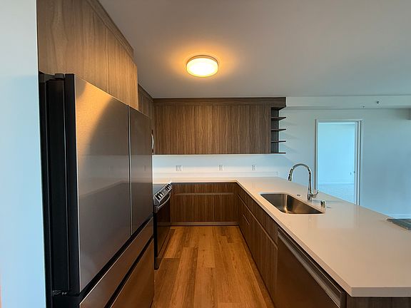 Kitchen with quartz countertops and modern fixtures