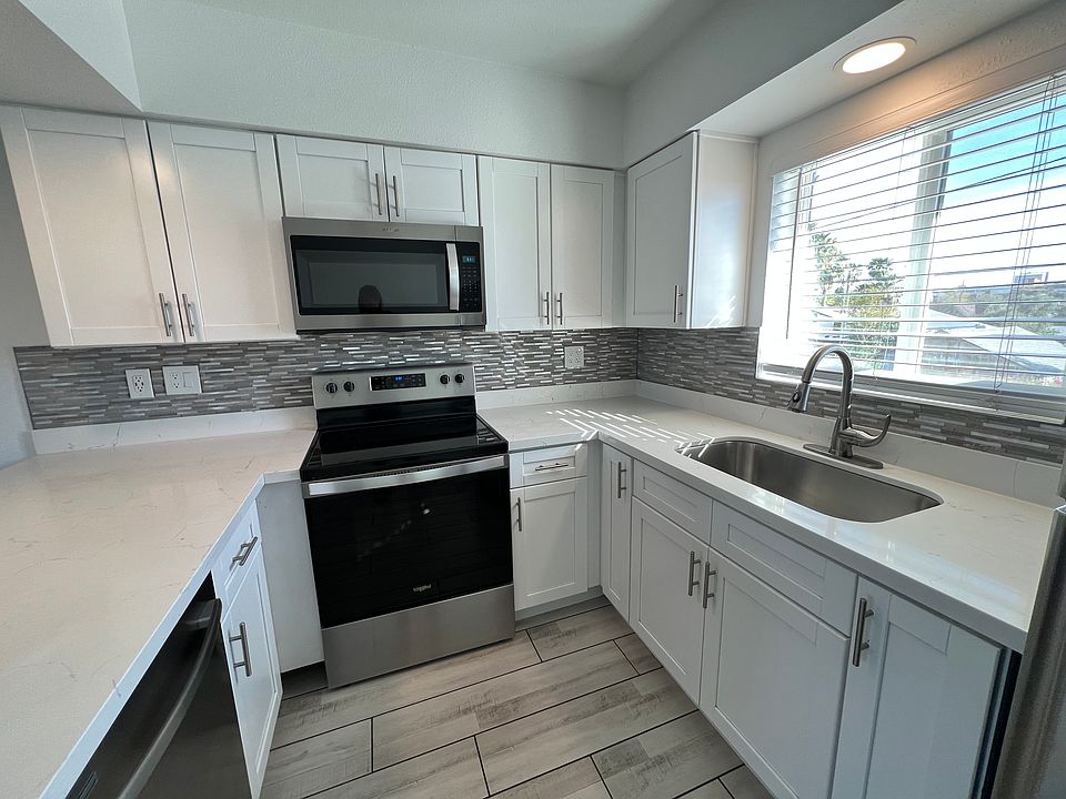 Bright kitchen with island, dishwasher, and large sink are the star of Unit #6!