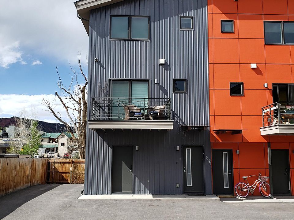 Gray Unit on left available. One bedroom. Storage and closet on entry level. living, kitchen, balcony and 1/2 bath on 2nd floor. Bedroom, office space and laundry on top floor.