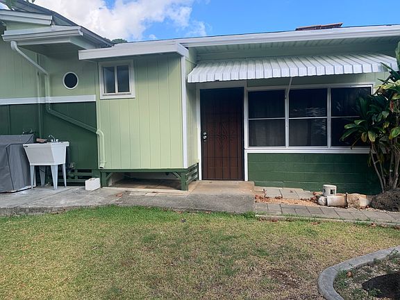 This is the entrance of to the unit from the back of the property