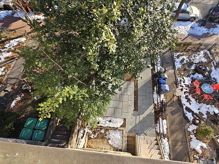 view over the front yard from 3d floor balcony.