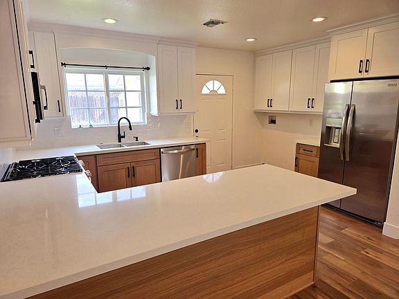 Completely remodeled kitchen with new cabinets, new countertops, new refrigerator, new stove / range, new microwave, new dishwasher, new sink, new faucet. Everything is NEW and Clean !