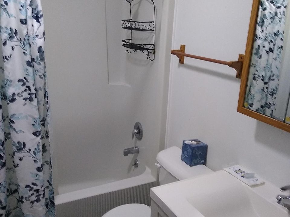Full size bath with a linen closet nearby.