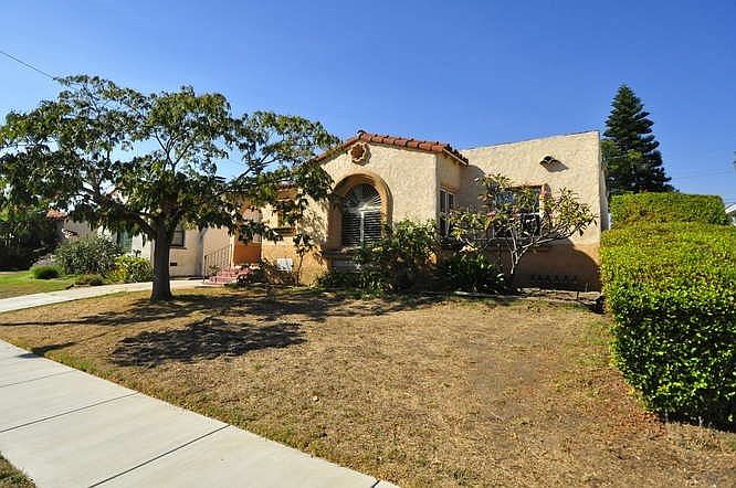 View is from NE.  Swift is a wide street, and Mimosa tree sets this home apart from others.
