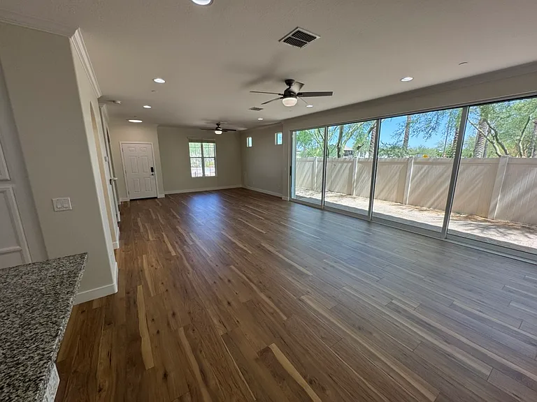 Great Room with 24 Ft Glass doors that open into private patio area.