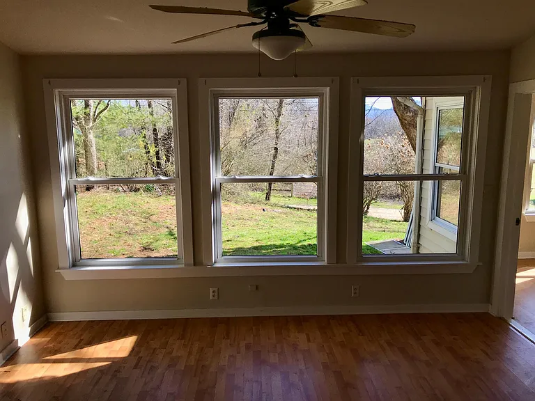 Office. Large windows. There is a exit to rear of house on left. This room approximate 16"x16".