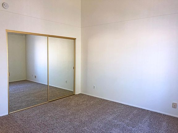 Master bedroom with mirrored vanity closet