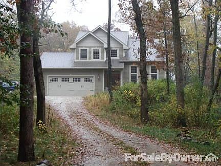 Main View of House & Location : View where driveway bends towards the house. View from road is drive