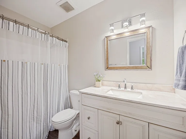Hall bathroom with a tub shower combo
