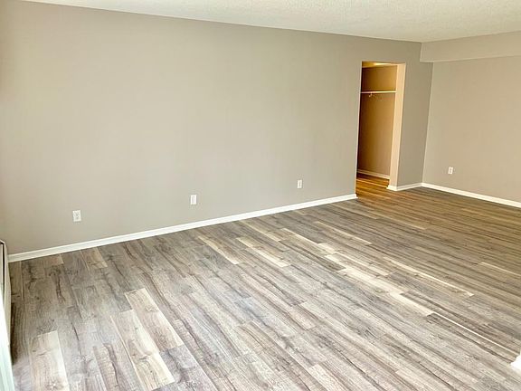 Large, bight living room, with walkout to exterior patio.