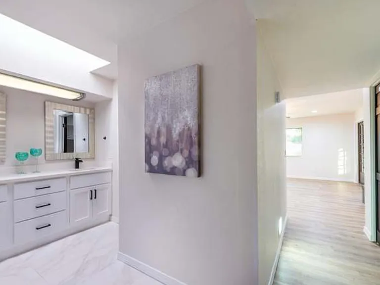Main bathroom + primary bedroom