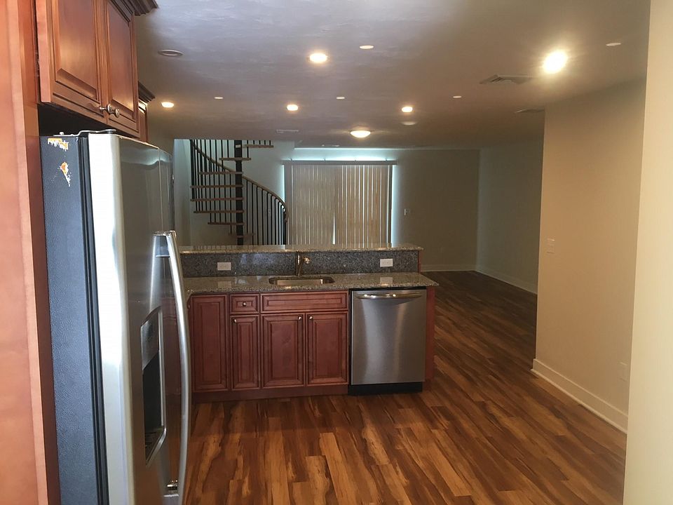 Beautiful stainless steel appliances, cabinets and gleaming floors