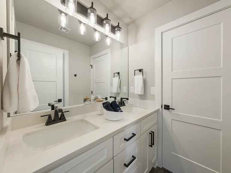 Jack and Jill bathroom is located and shared between bedroom 2 and 3. It has dual sinks