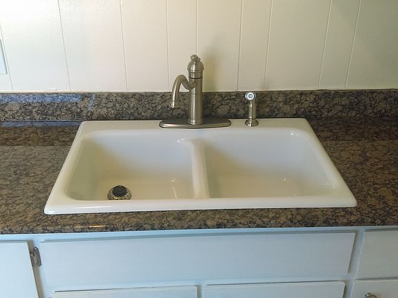 Granite counter tops in the updated kitchen. Brush nickel fi