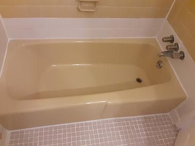 Upstairs bathroom full sized tub, newly caulked and has a shower head on the wall above