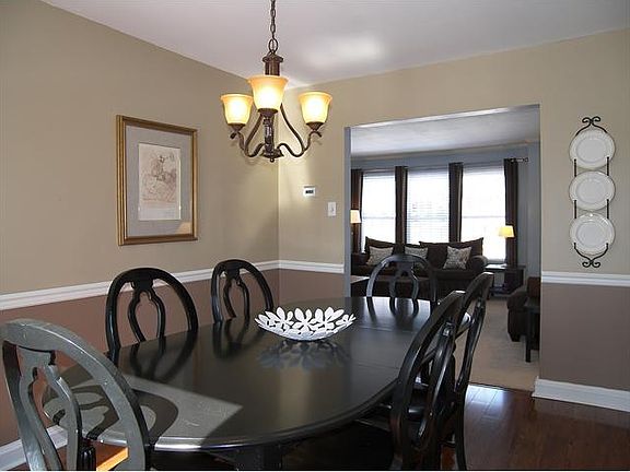 Formal dining room with hardwood flooring
