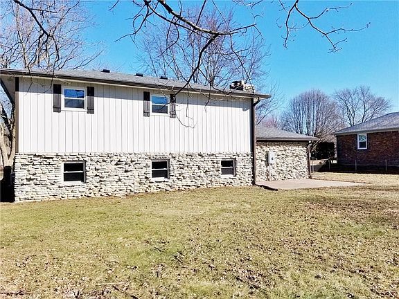 A nice look at the back of the home...fresh paing, new windows.....