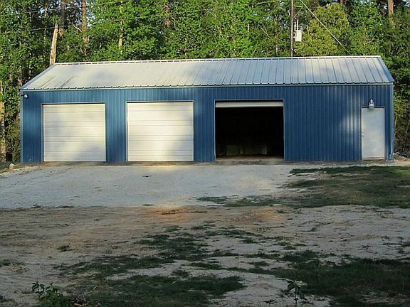  3 Car Oversize Garage with large storage area will stay on the property unless new homeowner does not want it.