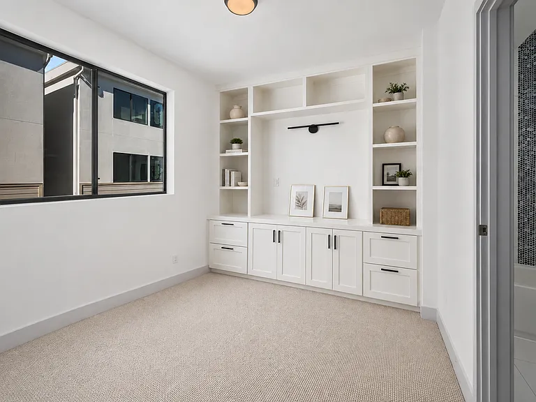 Third bedroom on 3rd level with built-in office nook or media center