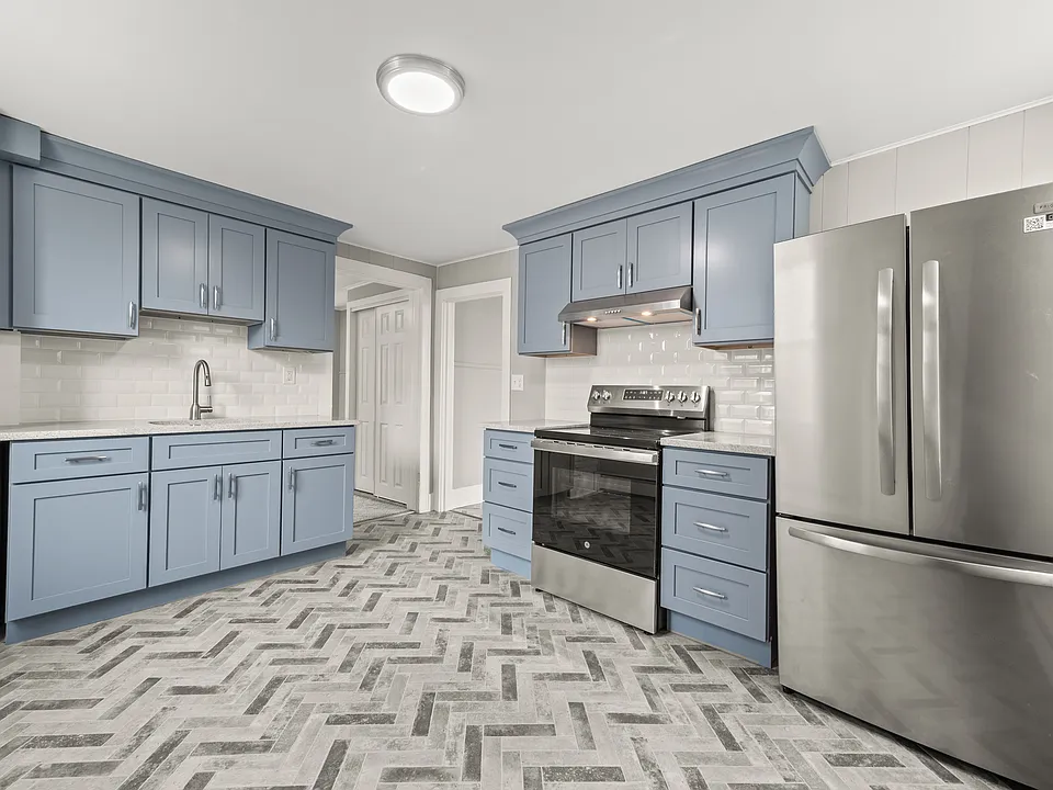 Remodeled kitchen with new appliances.