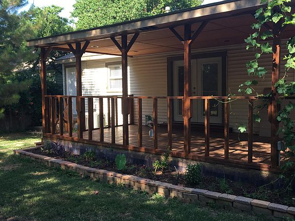 Deck in the backyard. the backyard has a privacy fence