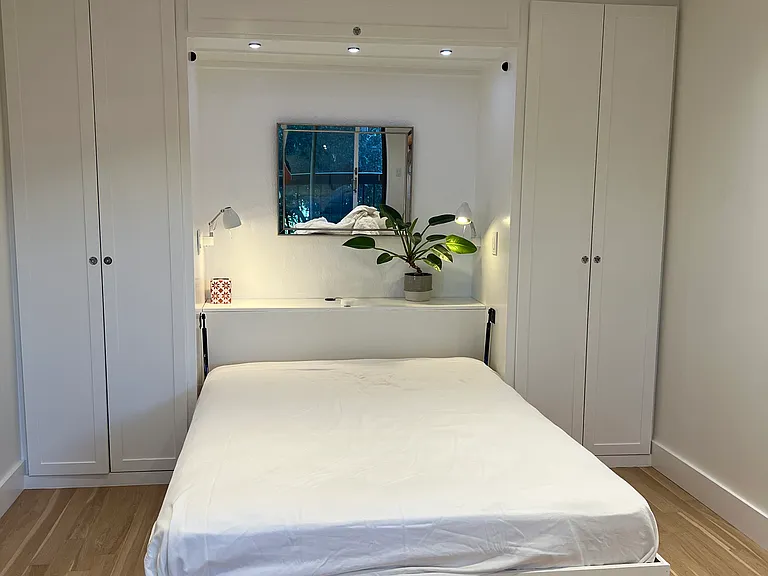 Large bedroom #2 (opposite end of hallway from primary) - Murphy bed and dual closets
