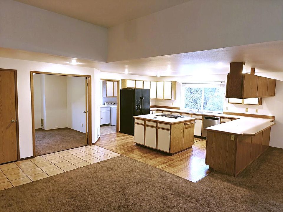 From the living area looking toward the kitchen, laundry room and office.