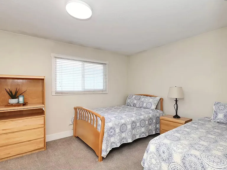 One full size bed and one twin bed in upstairs bedroom