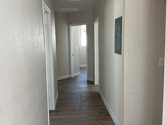 Hallway leading to 3 of 4 bedrooms.