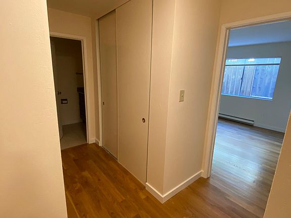 Hallway to bedroom, bathroom, and more storage