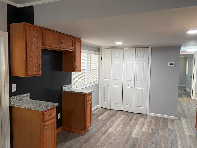 Kitchen with cutout for refrigerator (installing this week); closet has washer/dryer hookup.