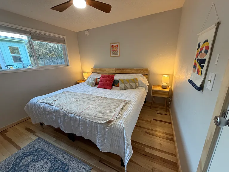 Second bedroom: One option for back bedroom: twins pushed together to make one large comfy king bed. Room also has large dresser in double closet-lots of storage space!