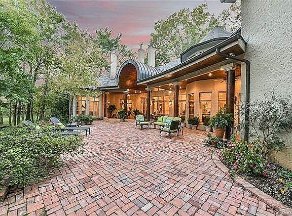 Rear brick patio w/  porch