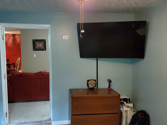 View of office into the back of the living room