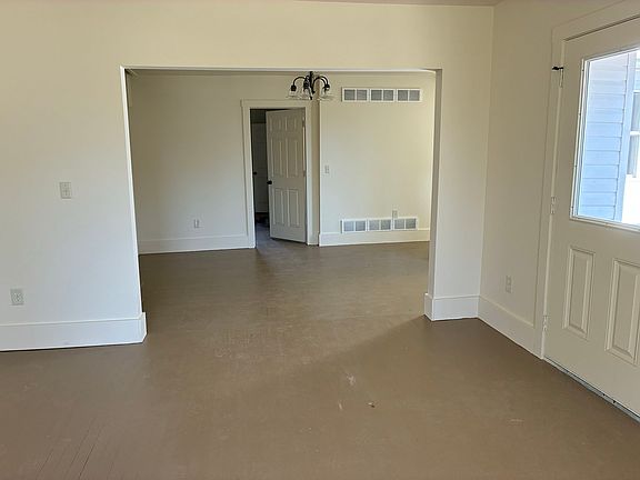 Standing in living room looking into dining room