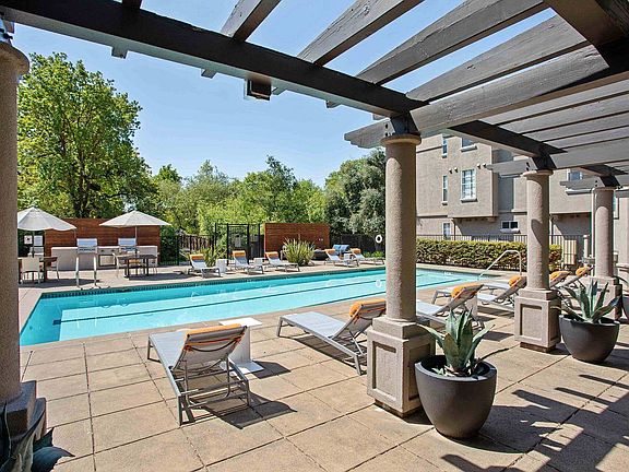 Relaxing pool side at Renaissance Apartment Homes.