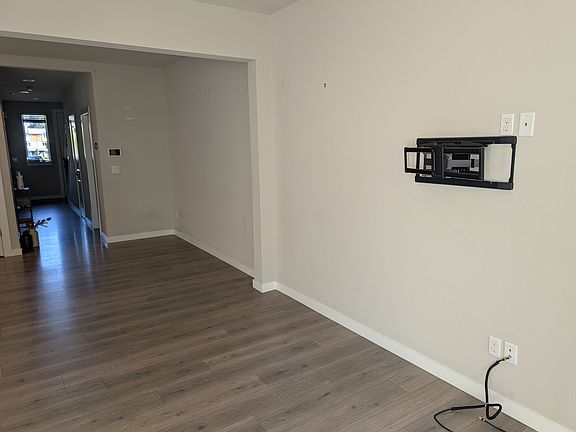 Open living room with TV mount already installed
