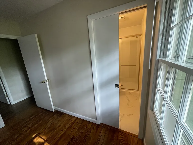 Master bathroom has a pocket door