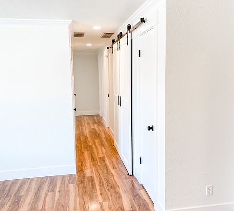 Hallway to bedrooms, 2 linen closets, washer/dryer & guest bath