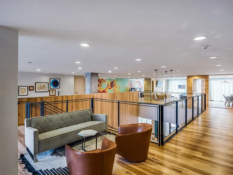 Resident Lounge Overlooking Business Center With Natural Light