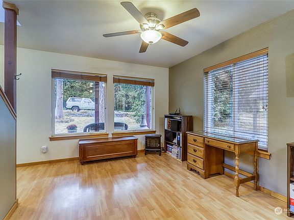 The great room enjoys light from the large windows.  >