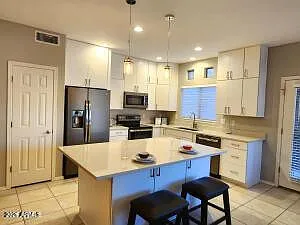 Building Photo - 9100 E Raintree Dr #140