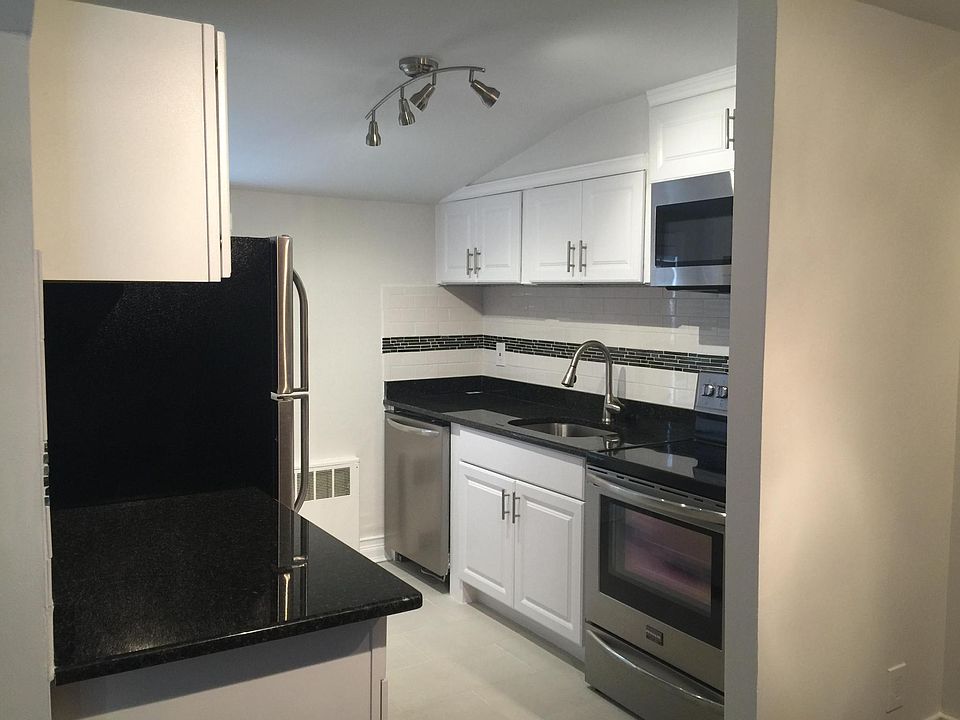 granite kitchen with stainless appliances