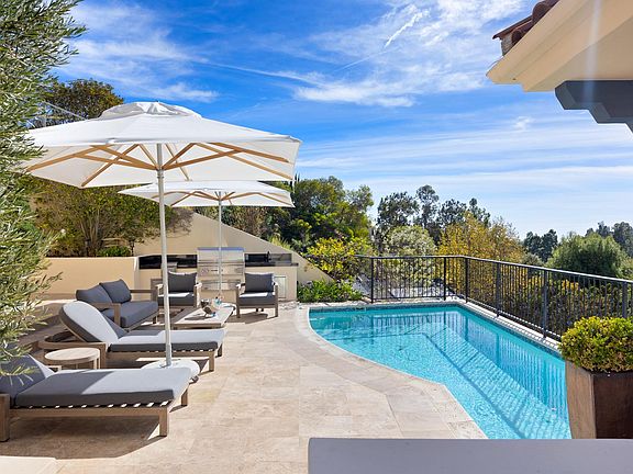 Take a dip in the gorgeous pool, conveniently located next to the outdoor BBQ and seating area