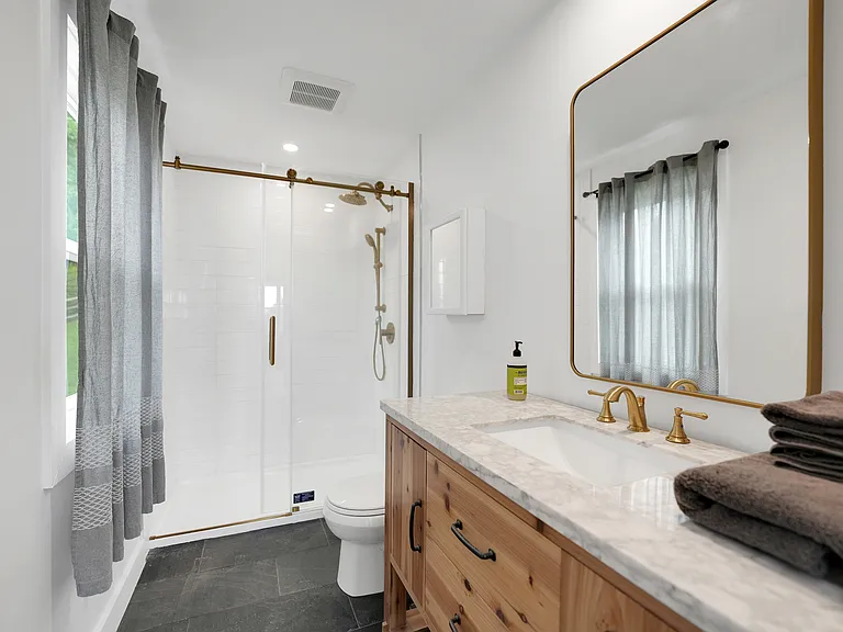 Spacious Master Bedroom Bathroom with rain shower and hand held.