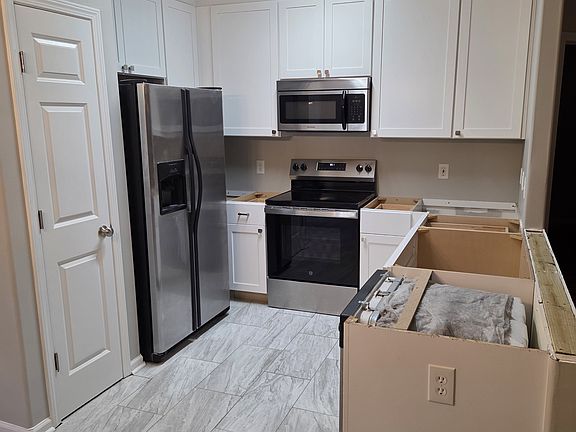 Brand new kitchen cabinet with new marble inspired countertop to come!