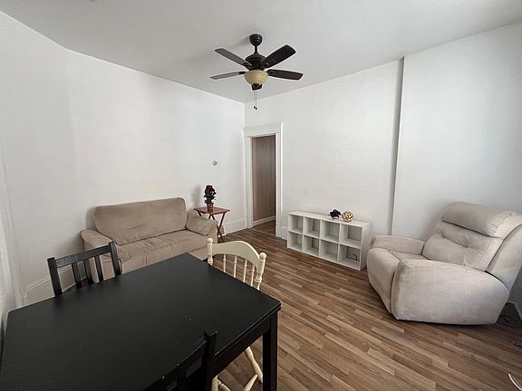 Cozy Living Room Space w/ Ceiling Fan & some Furnishings, window AC unit