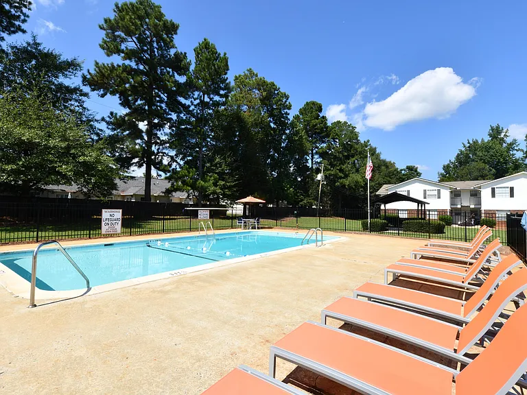 Pool area with lounge chairs
