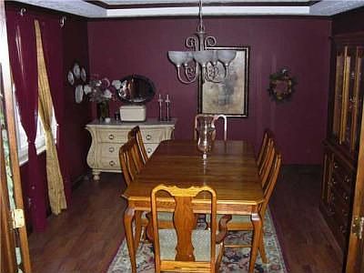 large dining room with wood laminate flooring for those big gatherings!