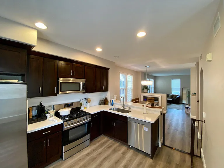 Kitchen opens to dining and living area.